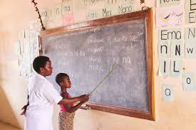 Teacher guiding young student